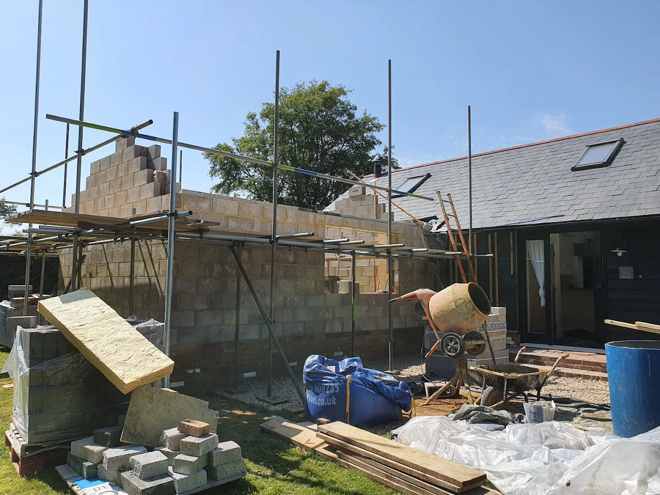 Blockwork barn extension under construction with scaffolding