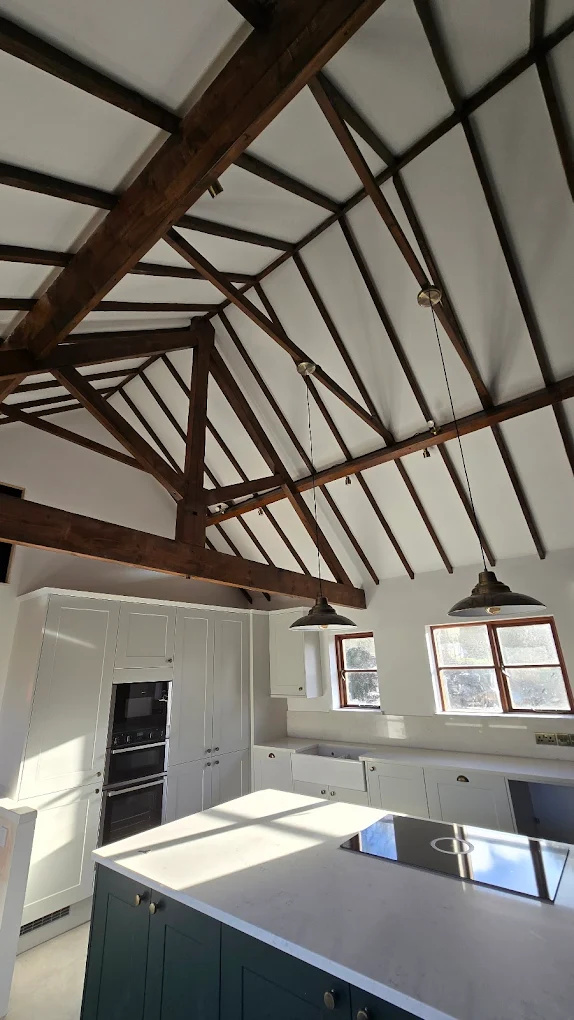 Vaulted kitchen with a freshly plastered ceiling finished around original beams