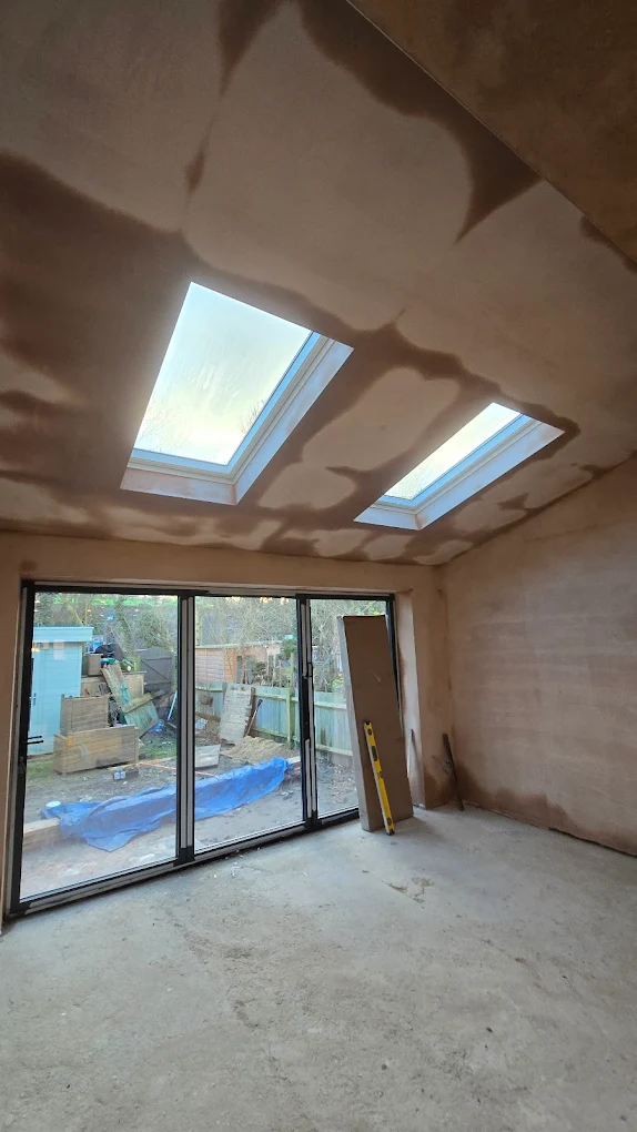 Freshly plastered extension interior with skylights