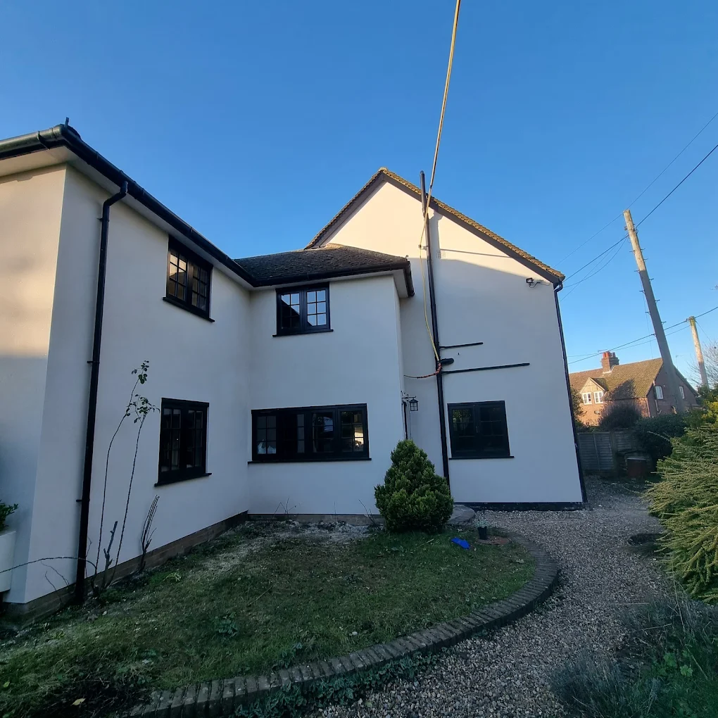 Detached house finished in smooth white render